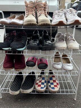 Different pairs of shoes and boots. Prices varie. The more you take, the cheaper